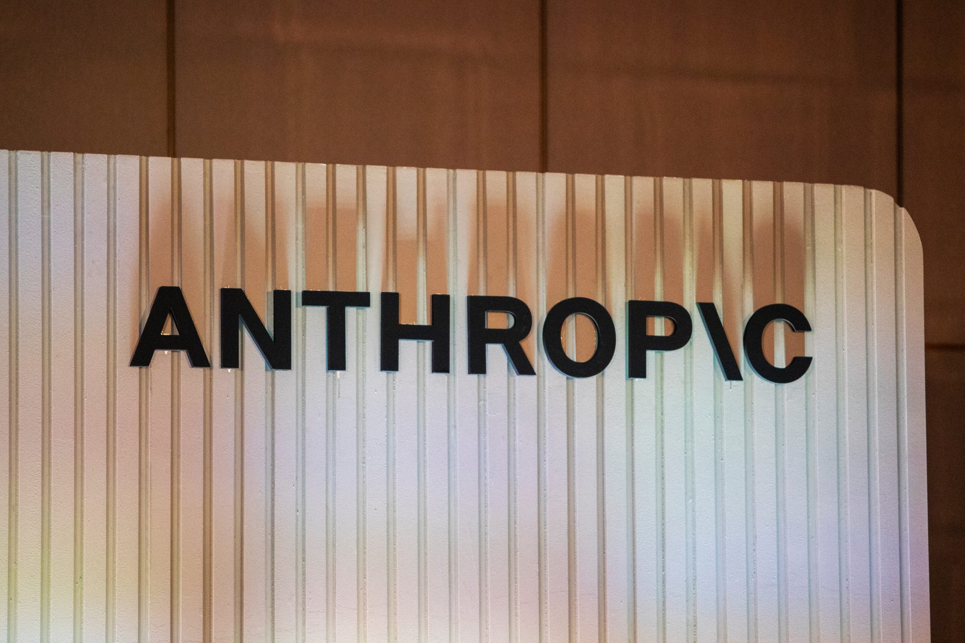 Anthropic company logo on a wall
