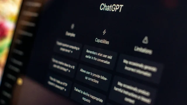A close-up of a ChatGPT interface on a dark screen listing capabilities and limitations